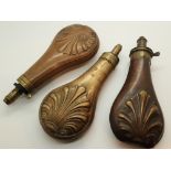 Three copper and brass antique powder flasks with impressed decoration