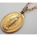 9ct yellow gold chain L: 60 cm and a presumed gold religious medal 6.