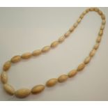 Antique graduated oval turned ivory bead necklace