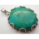 Large veined turquoise oval pendant set in white metal