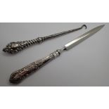 Silver handled letter opener in the form of a shoe hook