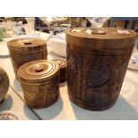 Four lidded carved wood kitchen storage boxes
