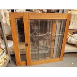 Two small glazed door fronts with leadwork and stained glass