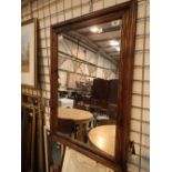 Stained pine framed bevel edged wall mirror