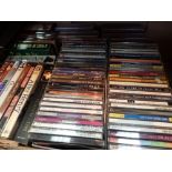 Box of CDs and DVDs