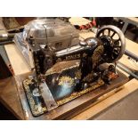 Jones hand powered wood cased sewing machine