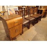 Oak dropleaf table and four chairs with upholstered seats with a mahogany veneered record cabinet
