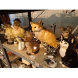 Shelf of ceramic cats with glass eyes owl and budgie figurines etc