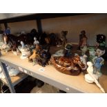 Shelf of mixed animals and figurines