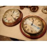 Pair of Quartz wall clocks with mahogany bases