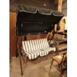 Large tubular steel garden swinging seat with canopy