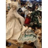 Group of collectable ceramic dolls in period dresses
