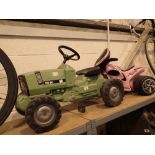 Childs pink plastic trike with childs ride on tractor pedal power