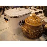 Enamel bread bin and a large lidded pot filled with scallop shells