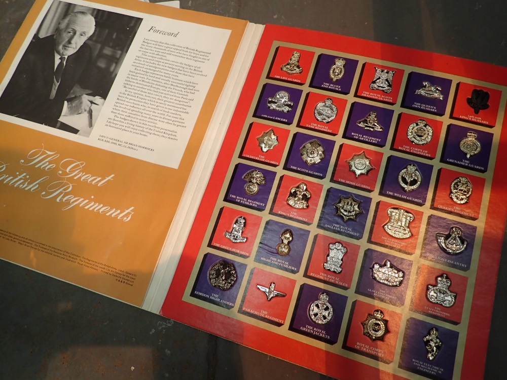 Thirty badges of The Great British Regiment in folder each with condensed history