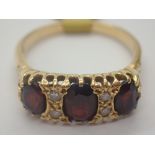 18ct gold antique three stone garnet ring set with diamonds size R in vintage ring box size R 5.