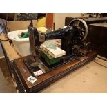 Jones hand powered Singer sewing machine with attachments