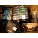 Box of audio cassettes including a 35 mm camera and film