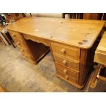 Contemporary pine kneehole desk with eight drawers 140 x 50 cm