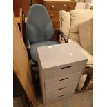 Rise and fall office chair with fabric covered four drawer storage cabinet