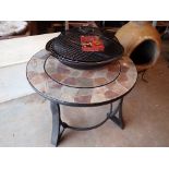 Stone topped steel table with centre barbecue