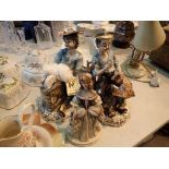 Three Capodimonte figurines two tramps and a lady