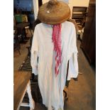 Gents Arabic clothing and a straw woven hat