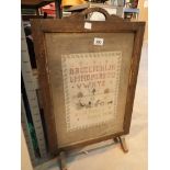 Vintage oak fire screen with hand embroidered panel sampler dated 1938