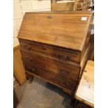 Mahogany bureau with three lower drawers with ball and claw feet