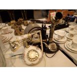 Two vintage style telephones and a mantle clock