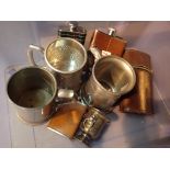 Collection of hip flasks and tankards