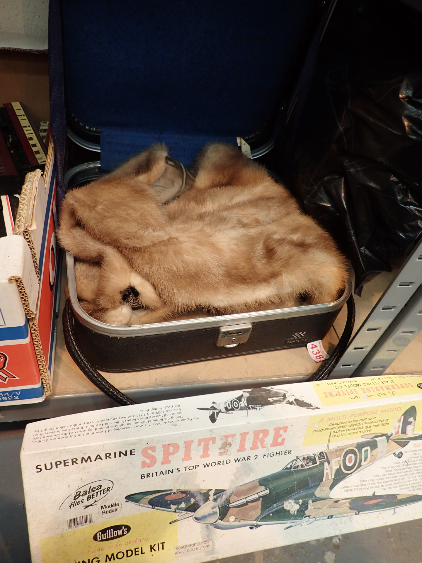 Supermarine Spitfire model kit with Toplite case and fur stole