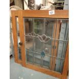 Two small glazed door fronts with leadwork and stained glass