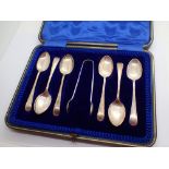 Six boxed silver spoons and tongs