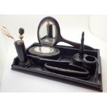 Ebony dressing table set with silver plaque