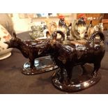 Pair of brown ceramic cow creamers