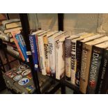 Shelf of hardback fiction books