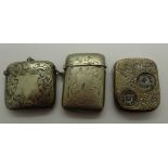 Two white metal vesta cases and a coin holder