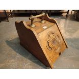 Victorian oak coal box with carved rosette lid and brass handle