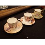 Set of three Royal Worcester cabinet cups and saucers Bramble London and English Flowers