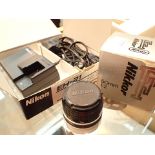 Nikkor 50mm f/2 lens and Nikon EH 21 AC adapter battery charger