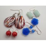Four pairs of fancy earrings with silver wires
