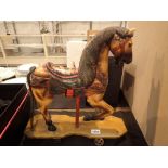 Wooden hand painted antique horse on wheels H: 40 cm