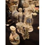 Six continental bisque figurines including spill holders and children largest H: 30 cm