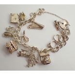 Sterling silver 1977 charm bracelet with assorted silver charms 48g