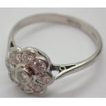 Platinum shank diamond flower headed ring approximately 1/2ct diamonds size M 3g