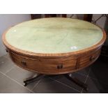 George III Regency mahogany drum table with green hide rising to reveal fitted dressing table.