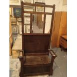 Oak hallstand with mirror back and lifting lid storage