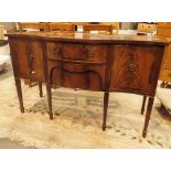 Serpentine mahogany sideboard on tapering supports