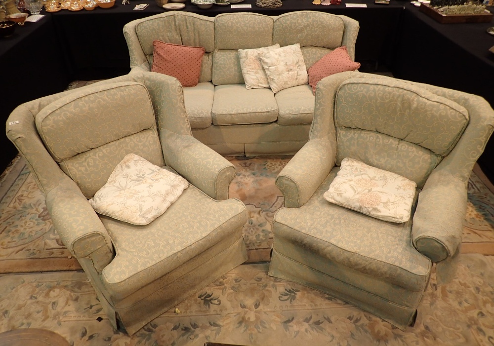Green upholstered three piece suite